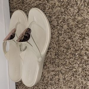 2 pairs of Croc flip-flops
